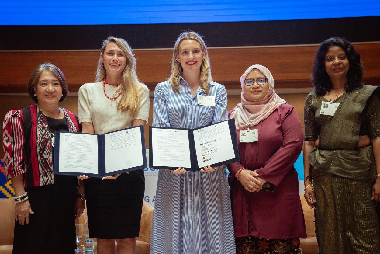 ESCAP and FDI Center representatives stand together