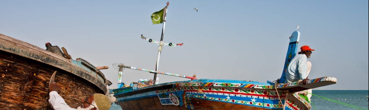 A man sitting on a canoe