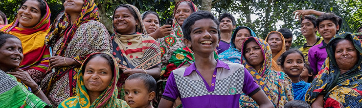 Women and children smiling